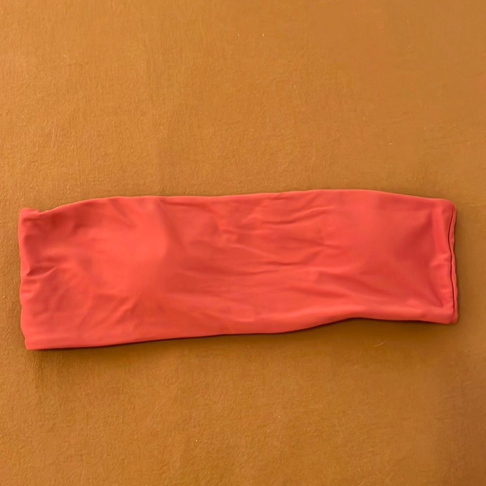 Burnt orange strapless bikini top. Removable pads. Never worn.